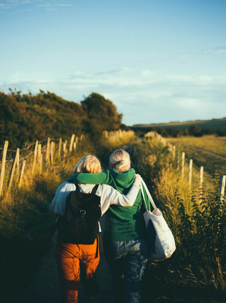 Two friends on walk providing emotional support for one another.