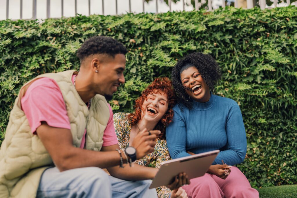 Three friends connecting and laughing.