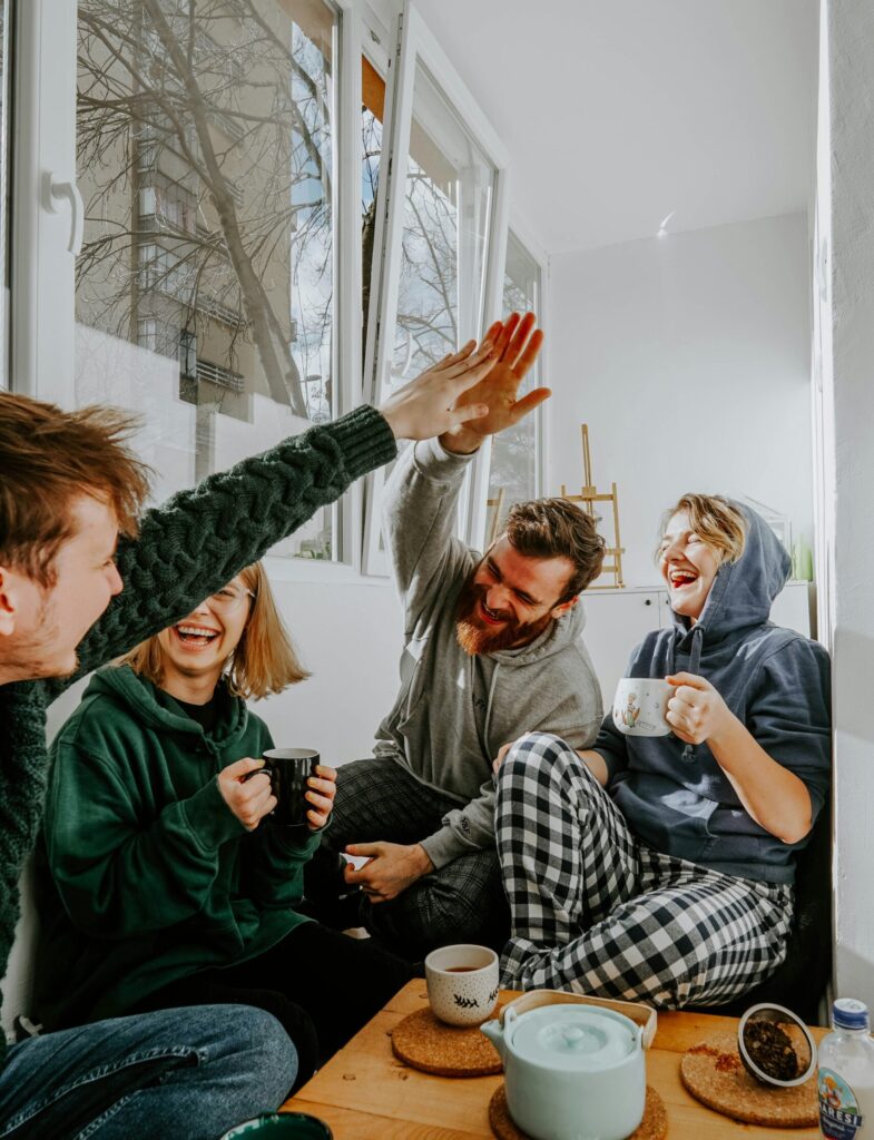 Group of friends celebrating growth and healing in therapy
